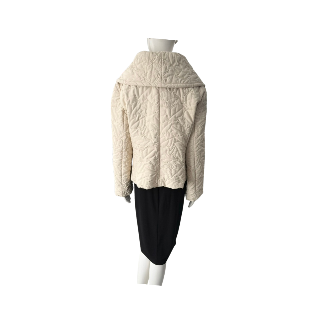Mannequin wearing a cream quilted jacket on a white background