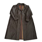 Brown trench coat with patterned lining on a white background