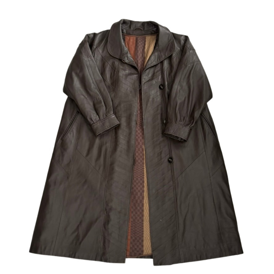 Brown trench coat with patterned lining on a white background