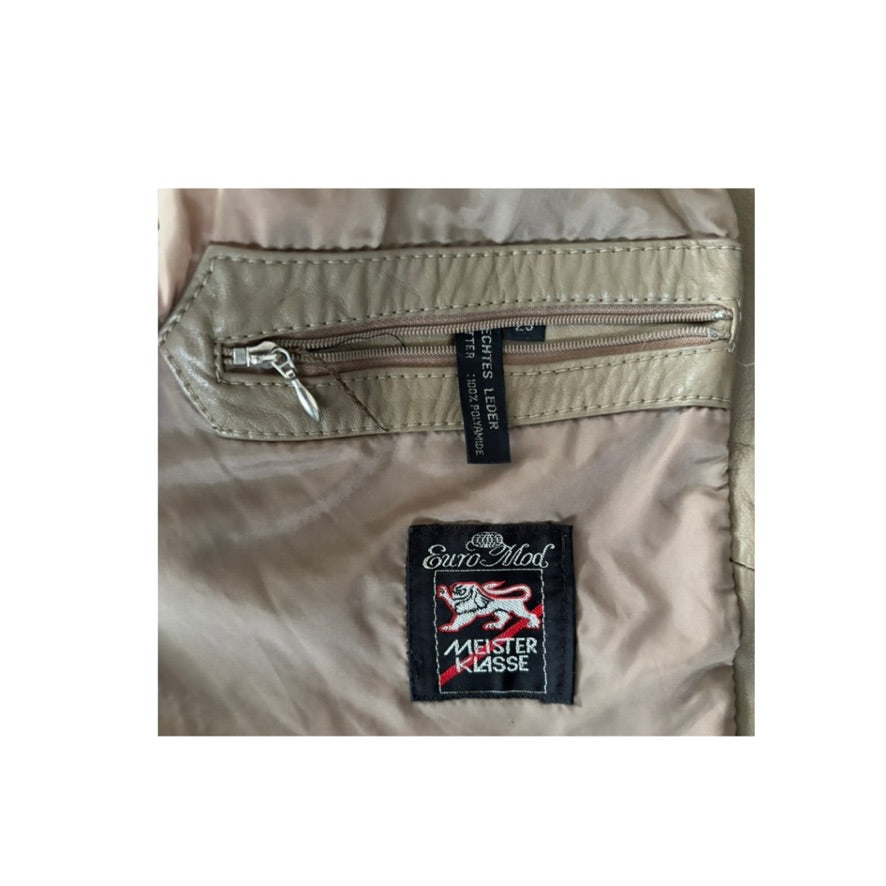 Close-up of a beige jacket with a visible brand tag on a white background