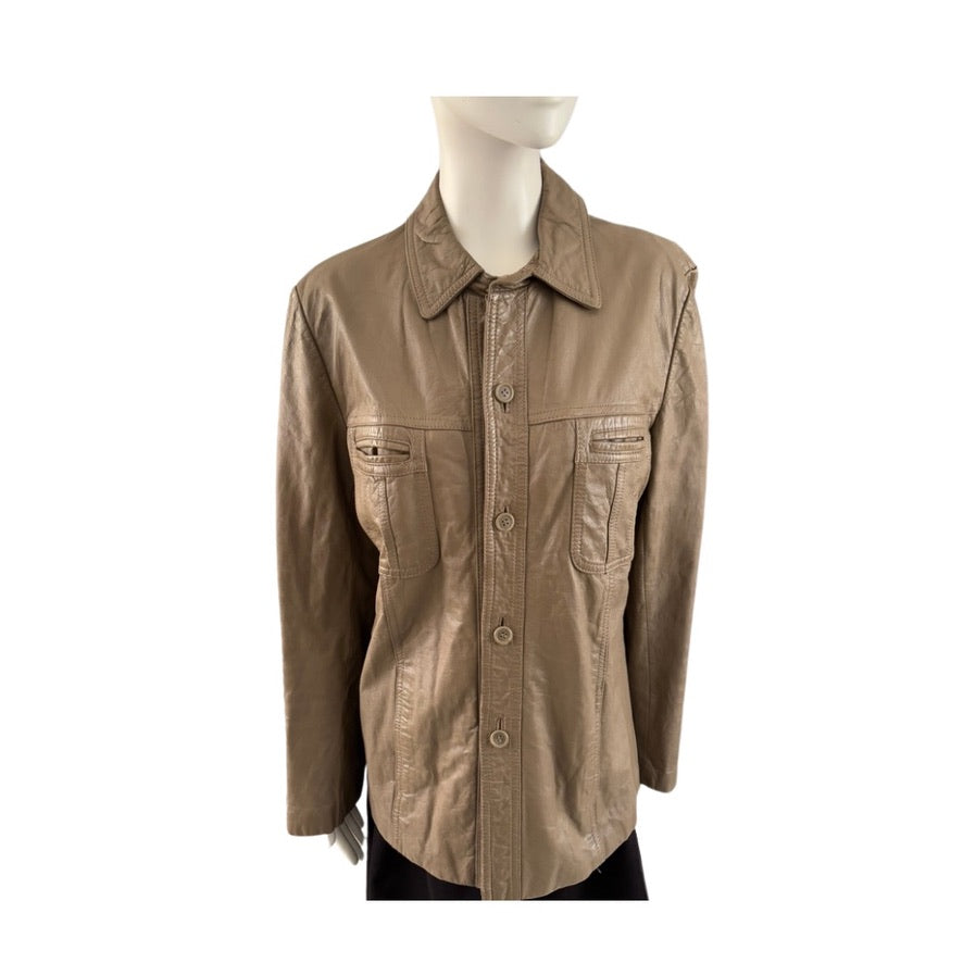 tan shirt on a mannequin against a white background