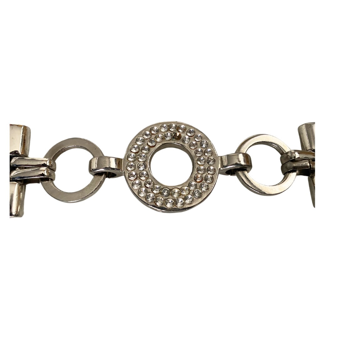 close-up of belt with silver tone hardware and loop chain intersections.