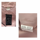 Close-up of a pink jacket with a brand label and fabric content label.