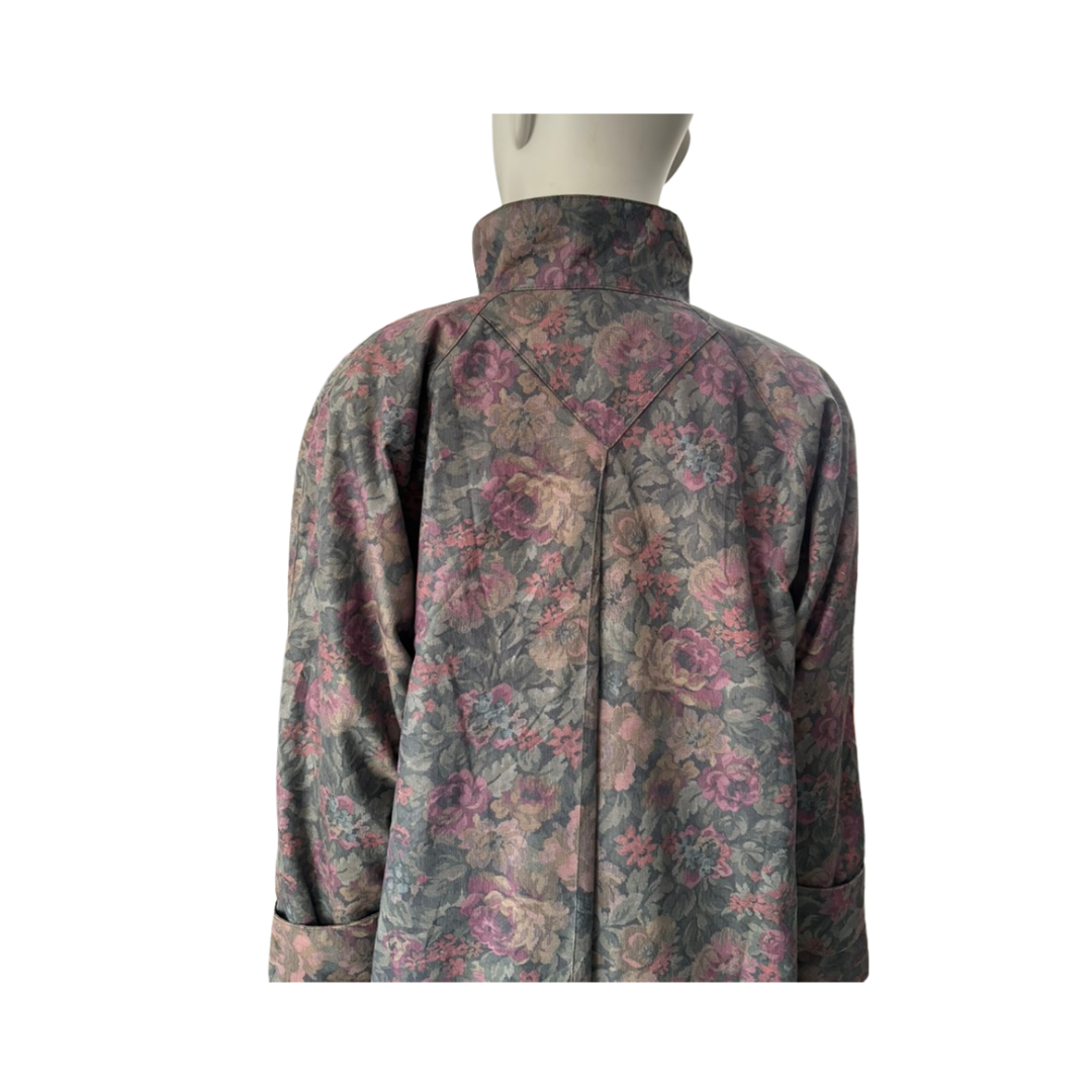 Floral patterned shirt on a mannequin against a white background