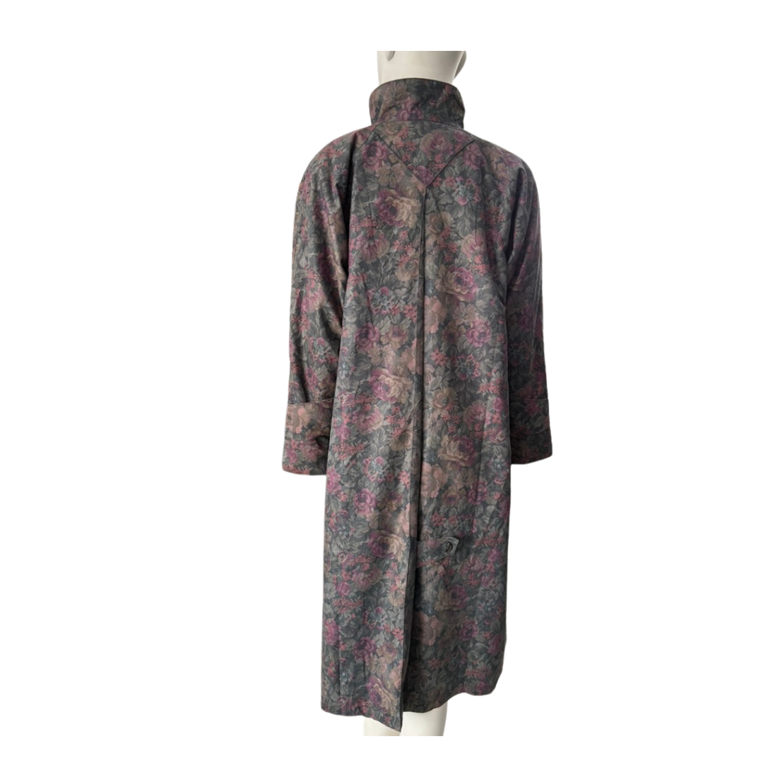 Floral patterned coat on a mannequin against a white background