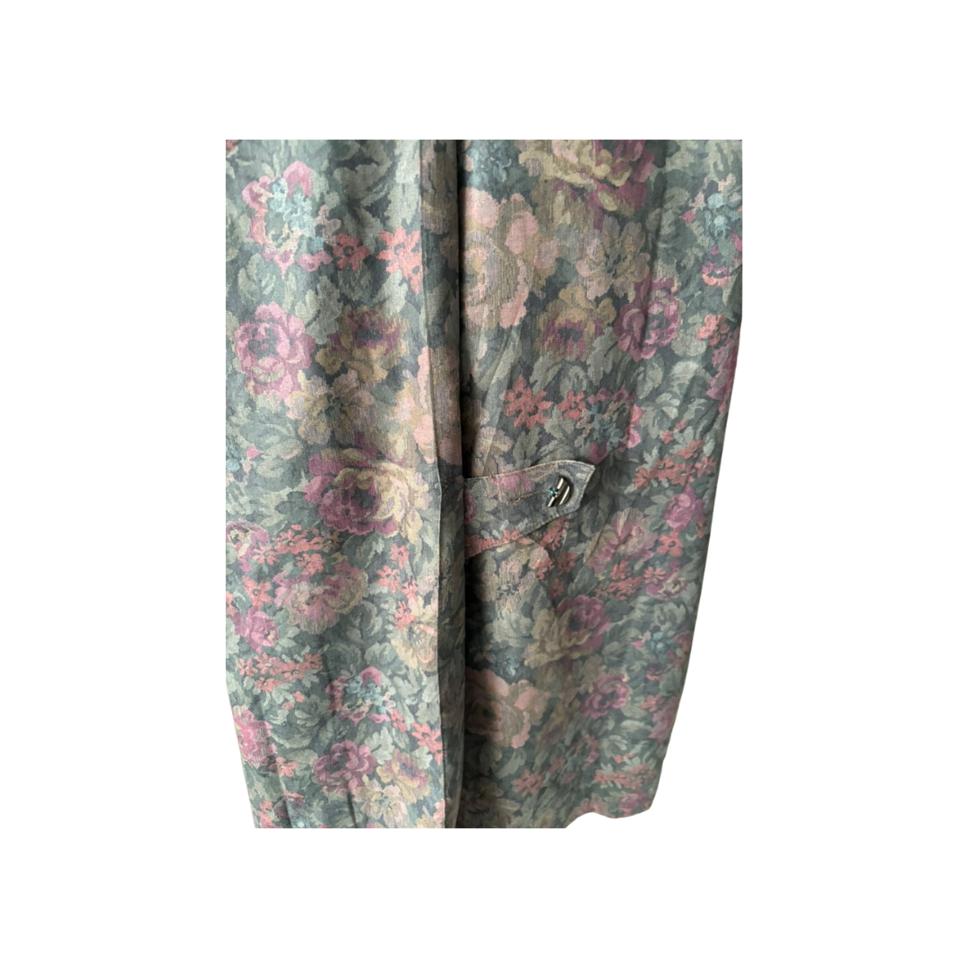 Floral patterned fabric with a button on a white background