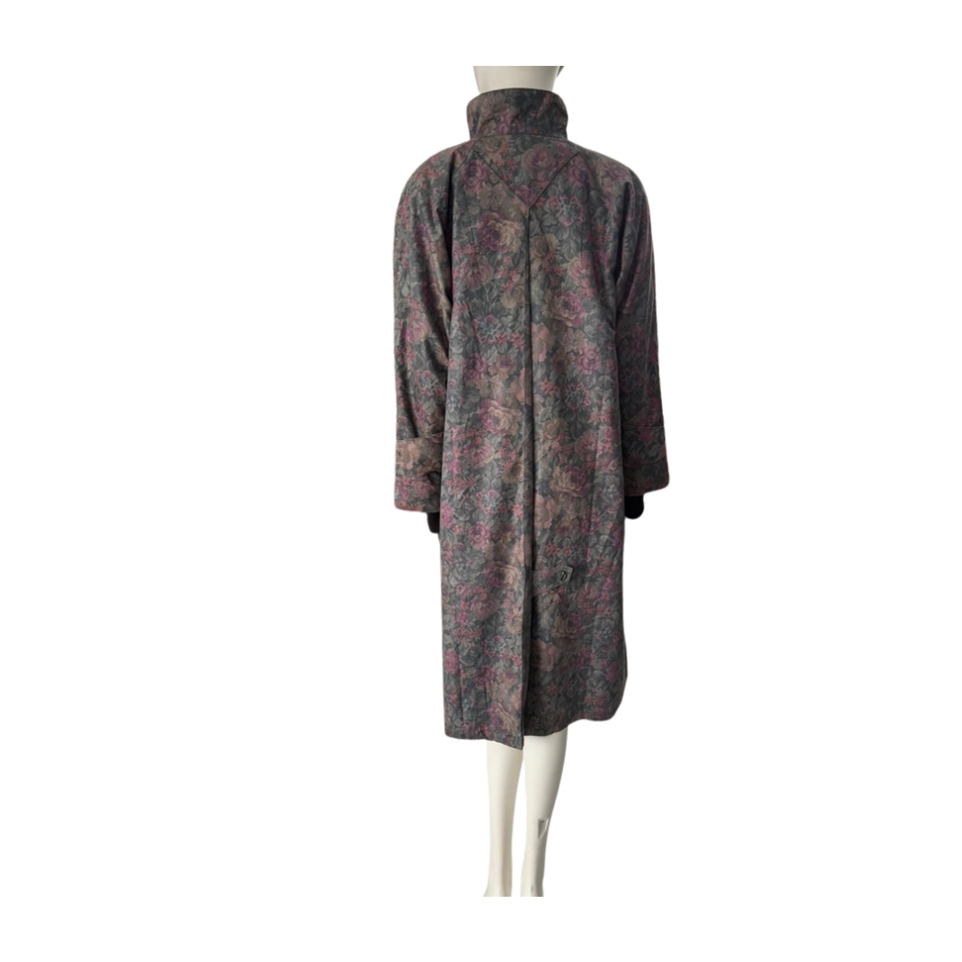 Long coat with a patterned design on a mannequin against a white background
