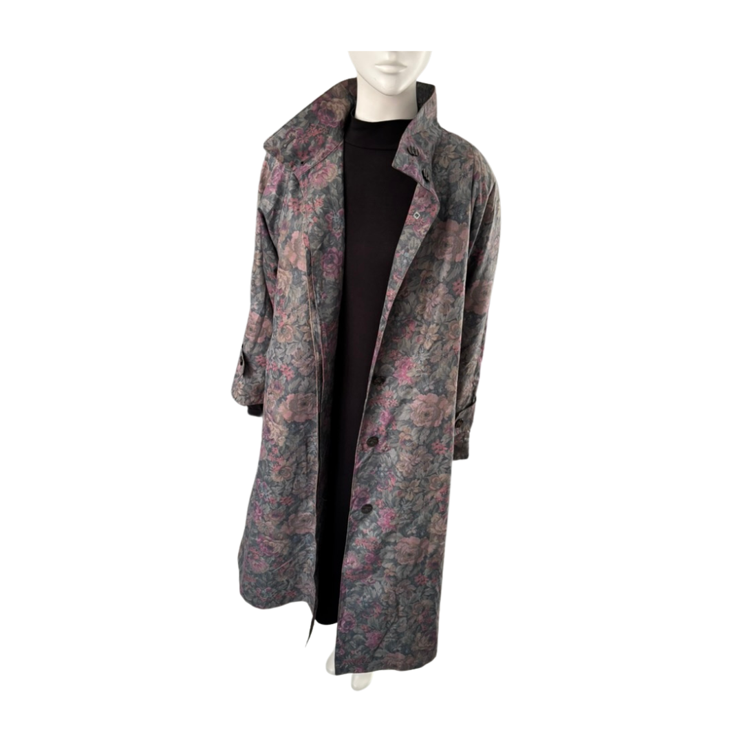 Floral patterned coat on a mannequin against a white background