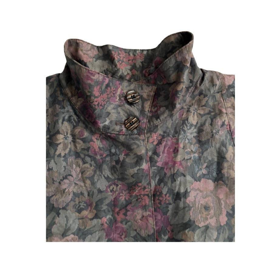 Floral patterned coat with buttons on a white background