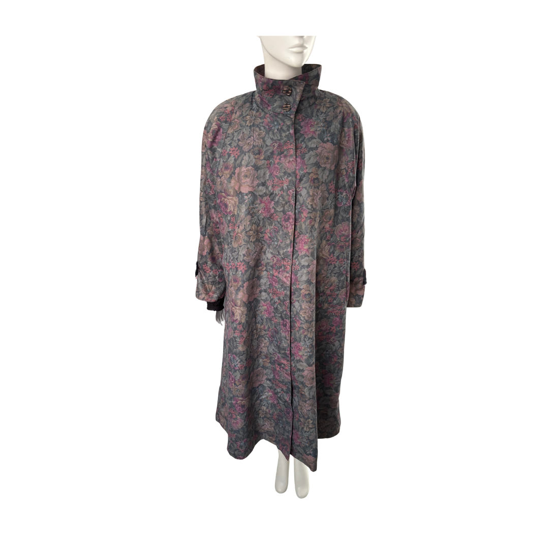 Long floral-patterned coat on a mannequin against a white background