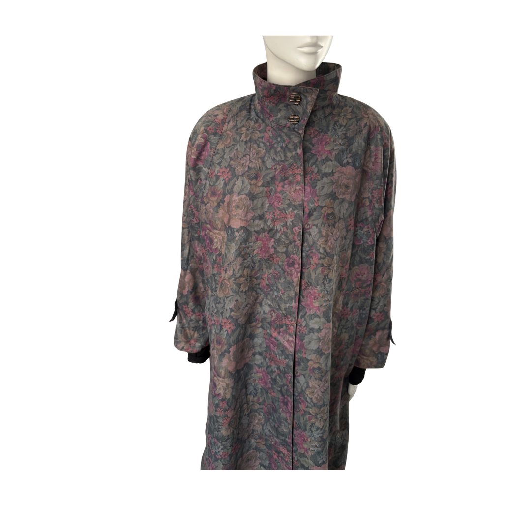 Floral patterned coat on a mannequin against a white background
