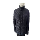 Quilted jacket on a mannequin against a white background