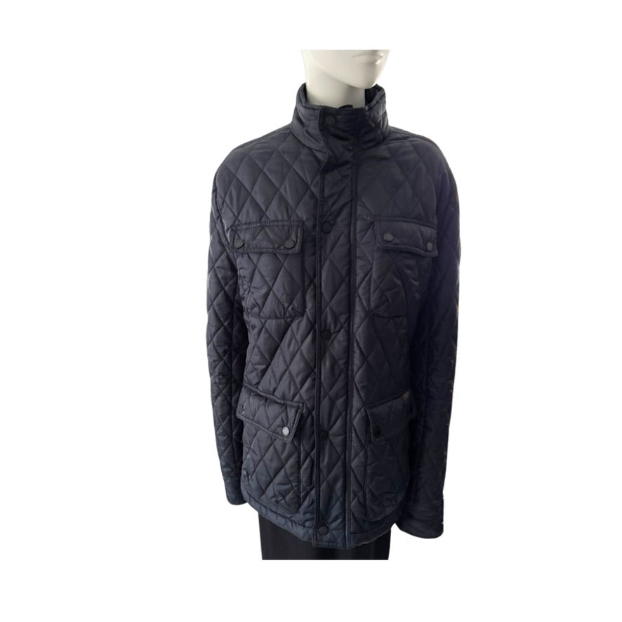 Quilted jacket on a mannequin against a white background