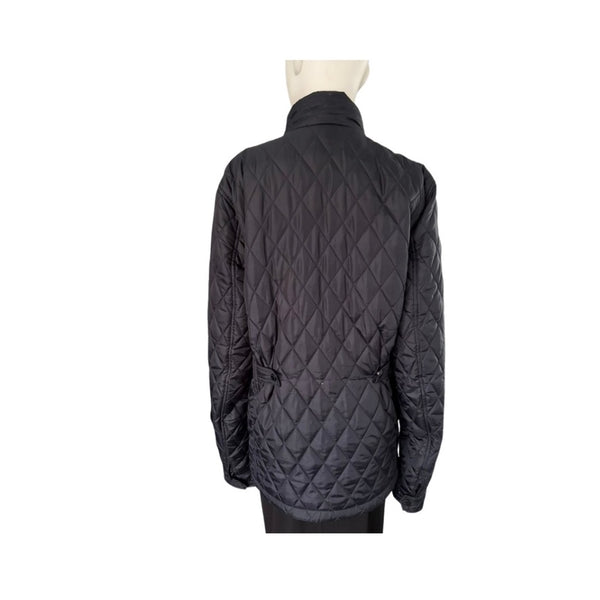 Navy quilted jacket on a mannequin against a white background