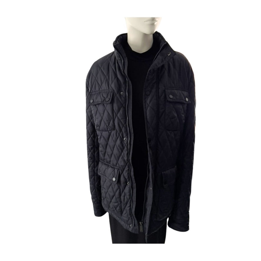 Navy quilted jacket on a mannequin against a white background