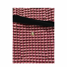Red and black patterned fabric with a gold button on a white background