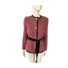 Red and black checkered jacket on a mannequin against a white background
