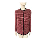 Red and black checkered jacket on a mannequin against a white background