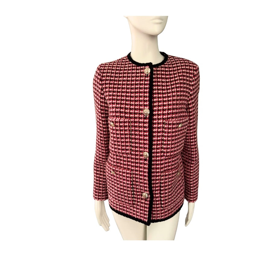 Red and black checkered jacket on a mannequin against a white background