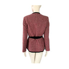 Red and black checkered jacket on a mannequin against a white background