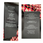 Close-up of Maje label on a garment with brand details.