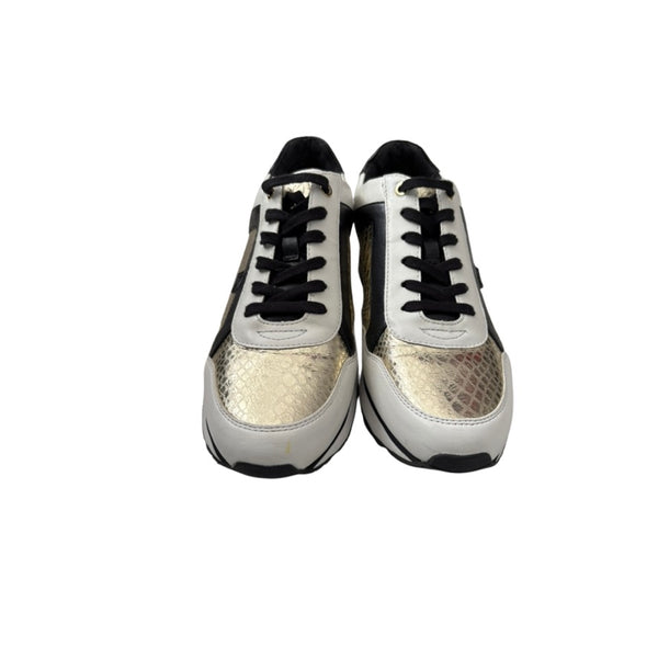 Pair of white sneakers with black accents on a white background