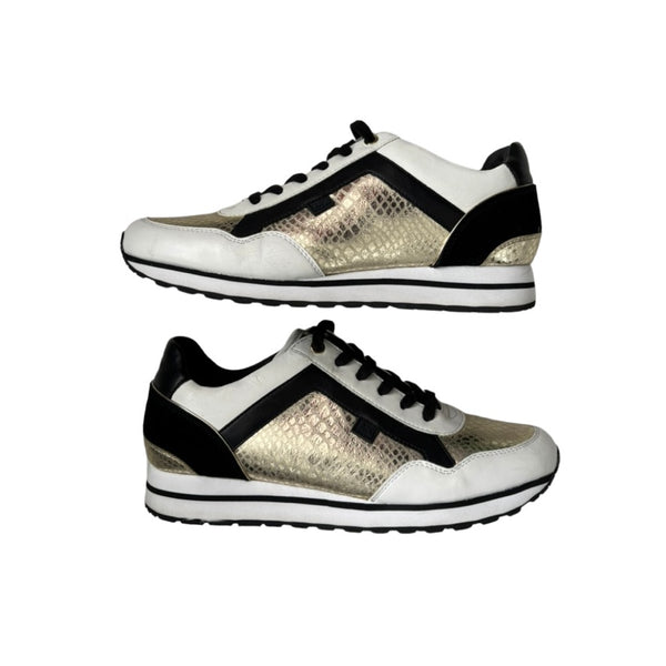 Pair of white sneakers with black and gold accents on a white background