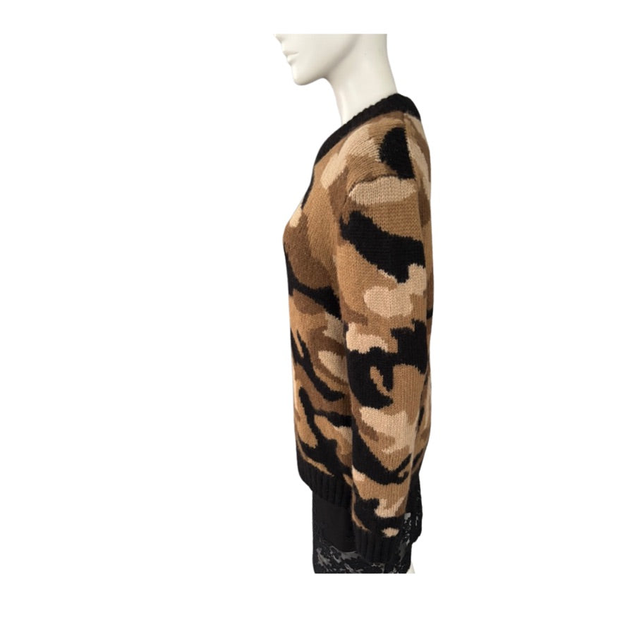 Camouflage-patterned sweater on a mannequin against a white background