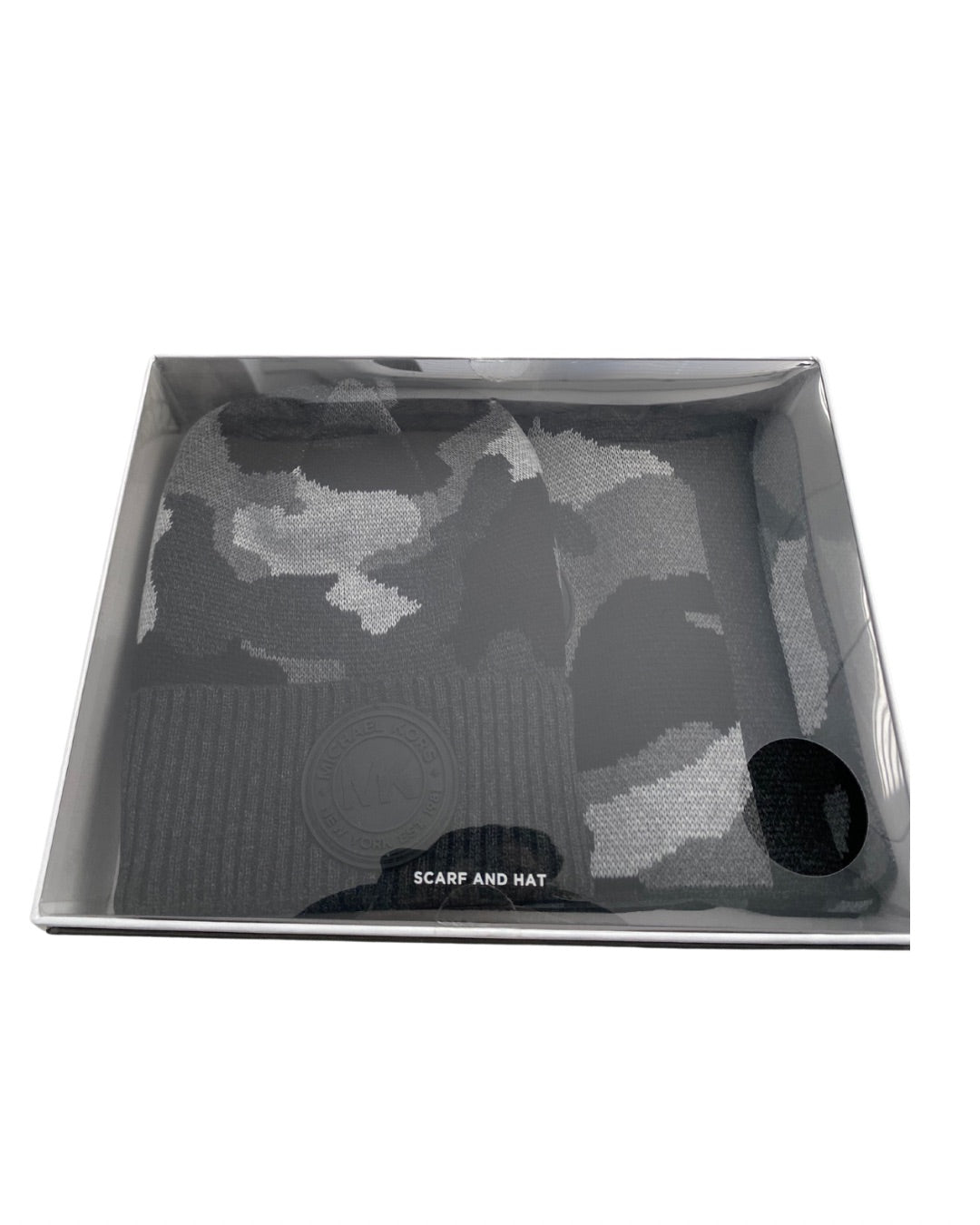 Grey camouflage scarf and hat set in a box on a white background