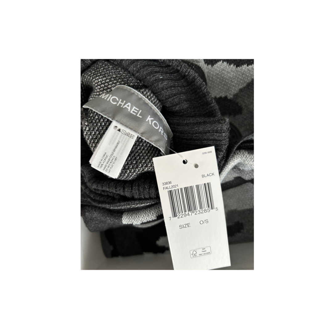 Knitted item with Michael Kors tag on a white background