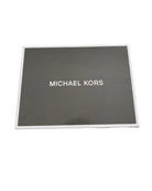 Grey box with 'Michael Kors' logo on a white background
