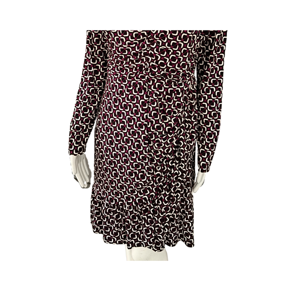 Long-sleeve dress with a pattern on a white background