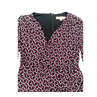 Close-up with geometric pattern dress on a white background