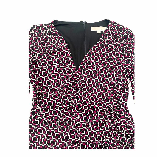 Close-up with geometric pattern dress on a white background