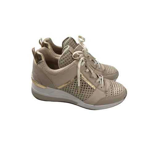 Beige sneakers with gold accents on a white background