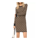 Woman wearing a patterned dress with a logo, holding a matching handbag on a white background