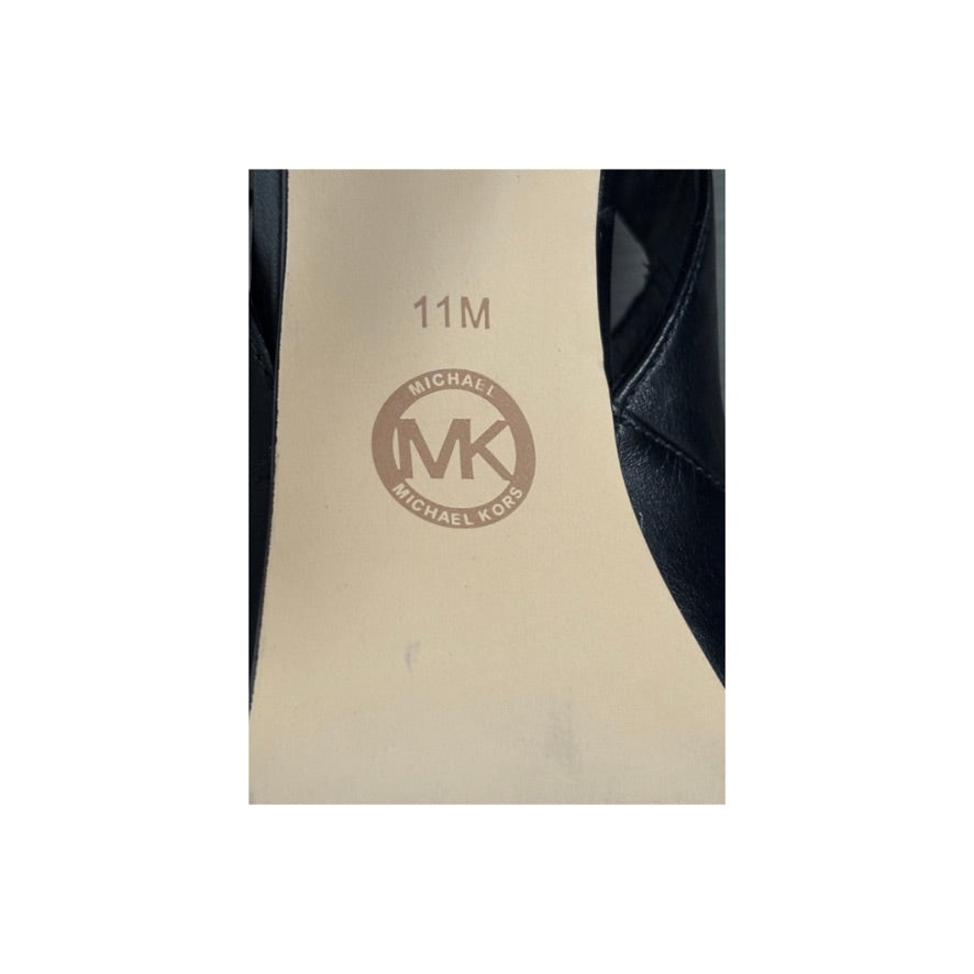 Close-up of a shoe insole with 'MK' logo and size '11M'.