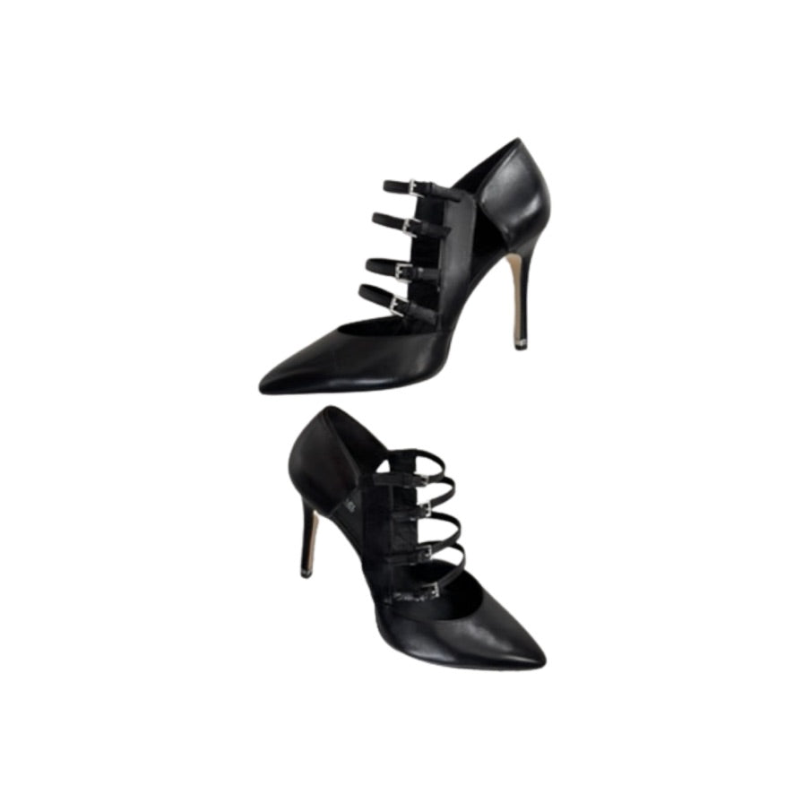 Black high-heeled shoes with strap details on a white background
