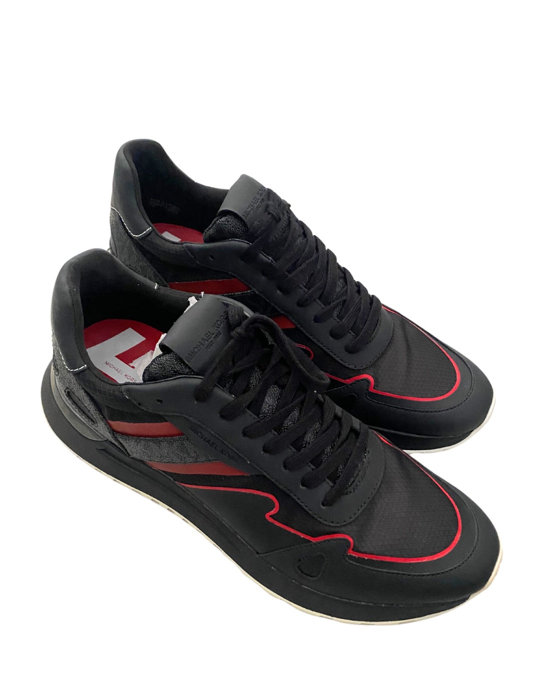 Black and red sneakers on a white background