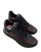 Black and red sneakers on a white background