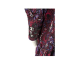 Close-up of a paisly dress cuff with a white background