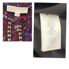 Close-up of a clothing tag with 'Michael' brand name and text on a garment.