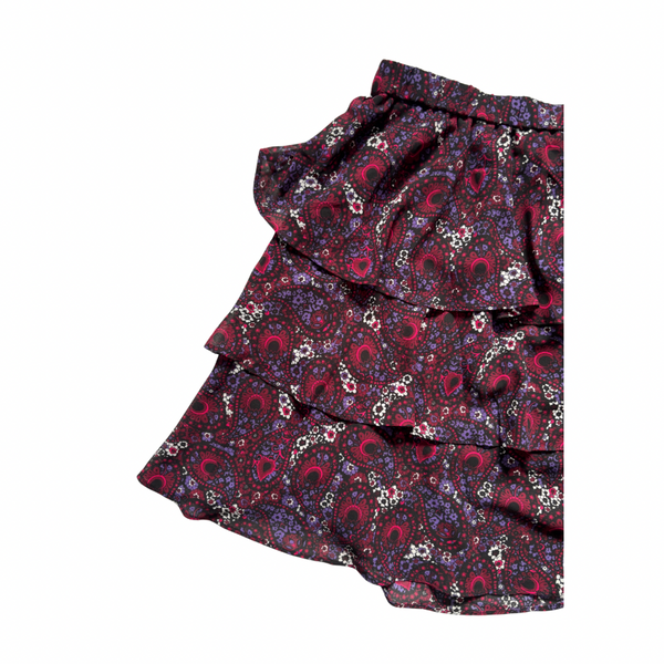 Paisley patterned skirt with ruffled layers on a white background