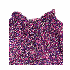 Floral patterned top on a white background