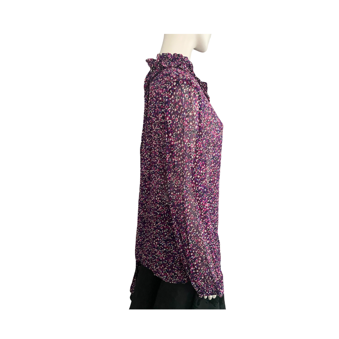 Purple floral blouse on a mannequin against a white background