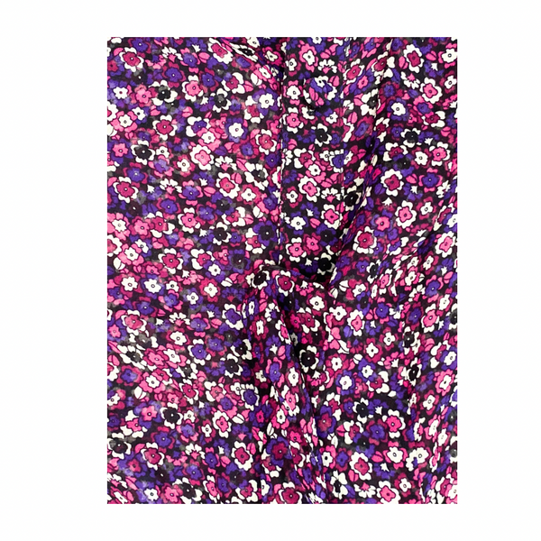 Floral patterned fabric with pink and purple flowers on a white background