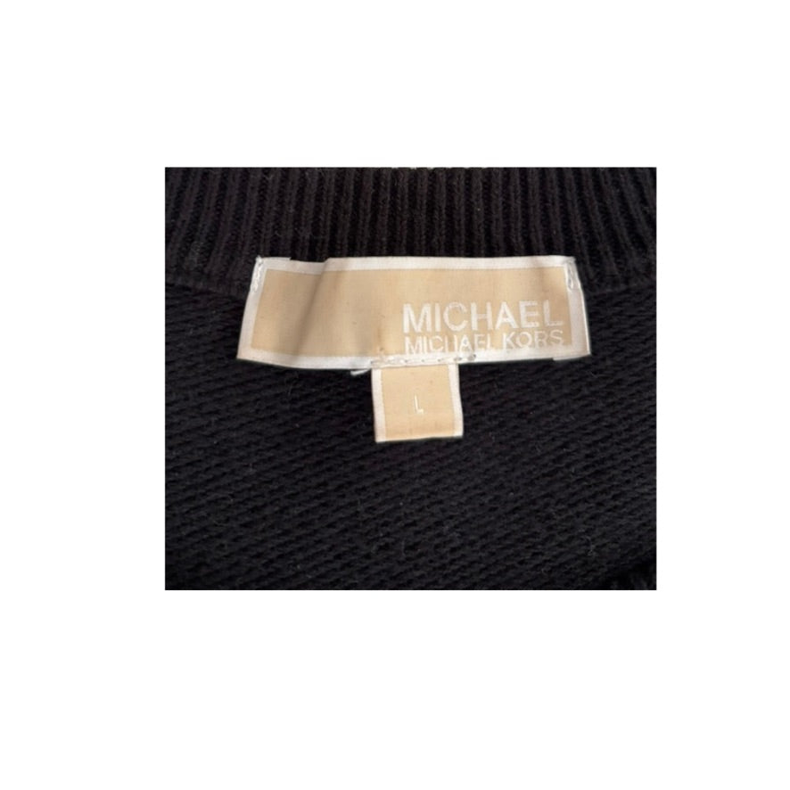 Close-up of a Michael Kors label on black fabric