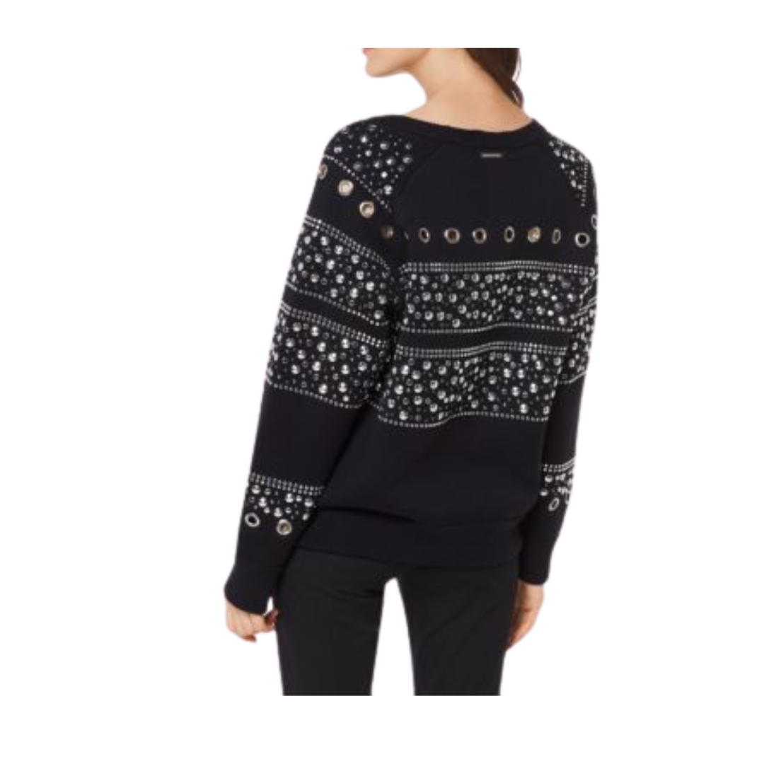 Black sweater with white pattern and decorative buttons on a white background