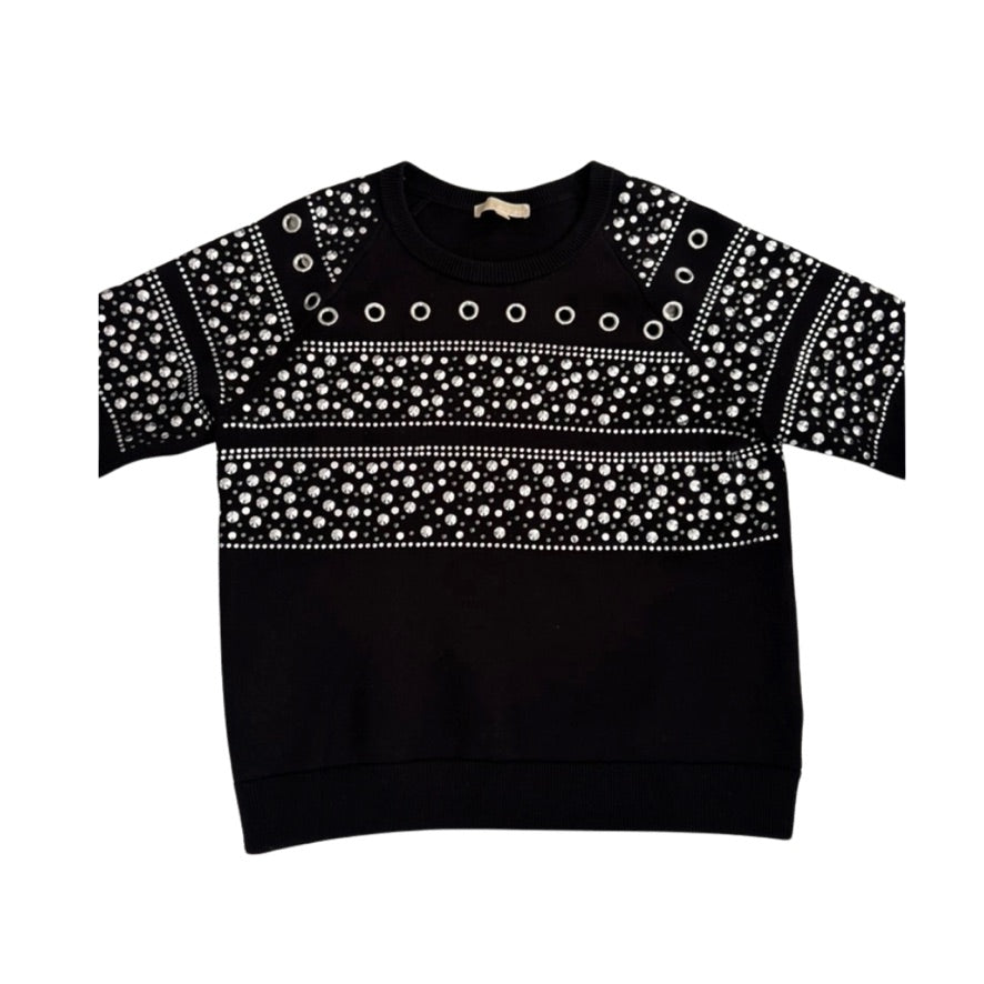 Black sweater with white pattern on a white background
