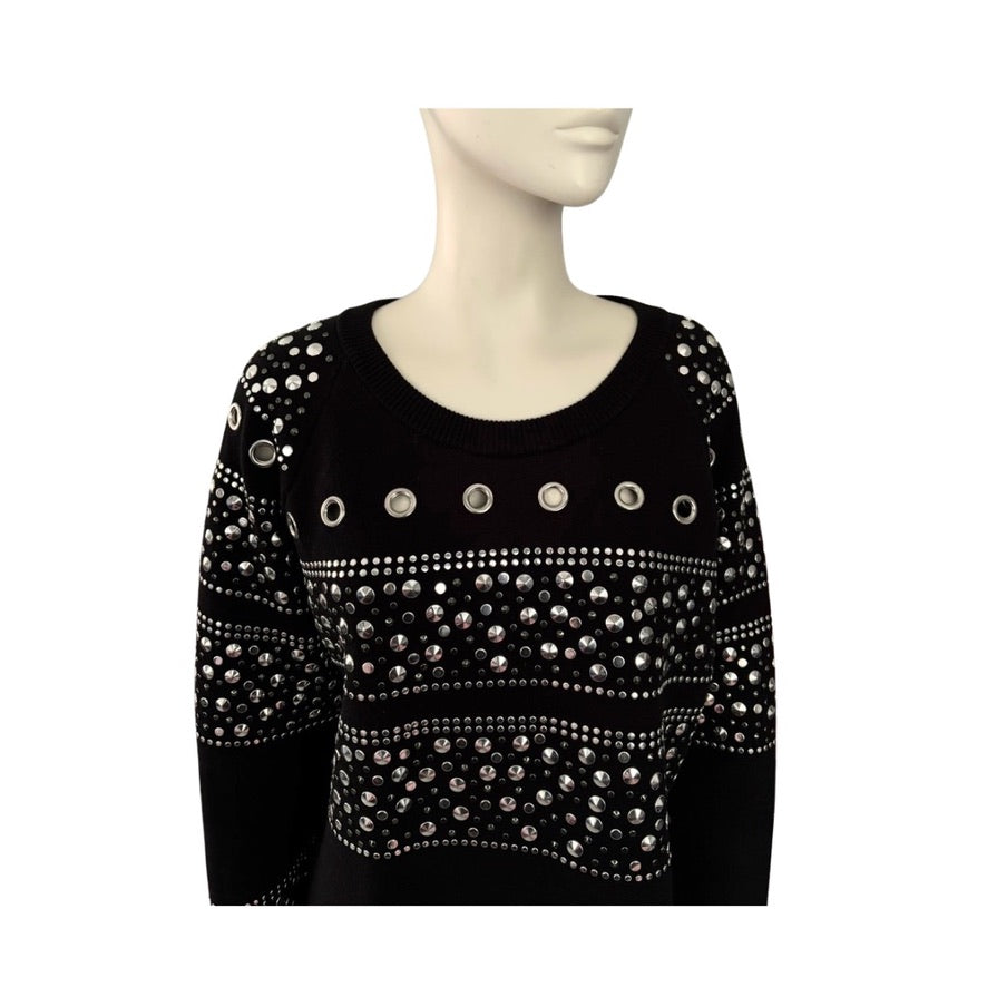 Black top with silver embellishments on a mannequin against a white background